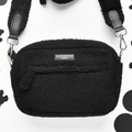 Black teddy fabric dog walking bag with white polka dots and built-in poop bag dispenser.