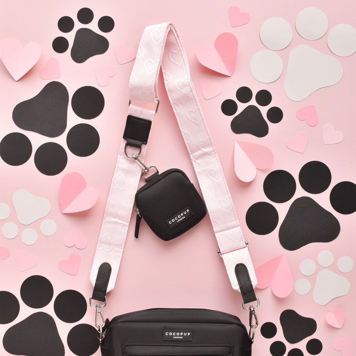 Baby pink dog walking bag bundle with heart pattern, matching treat pouch, pink heart strap, and paw details.