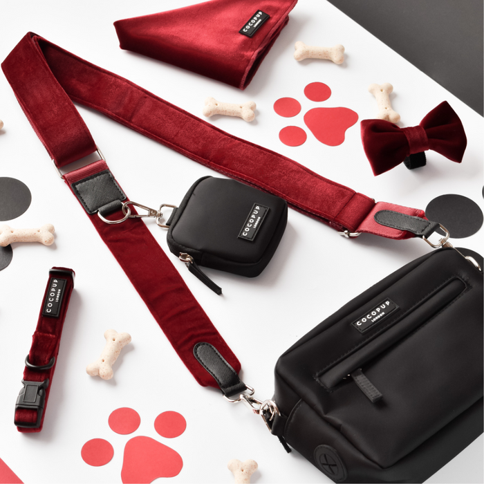 Berry red velvet Cocopup London dog walking bag bundle with matching treat pouch, bow tie, collar, and bandana.