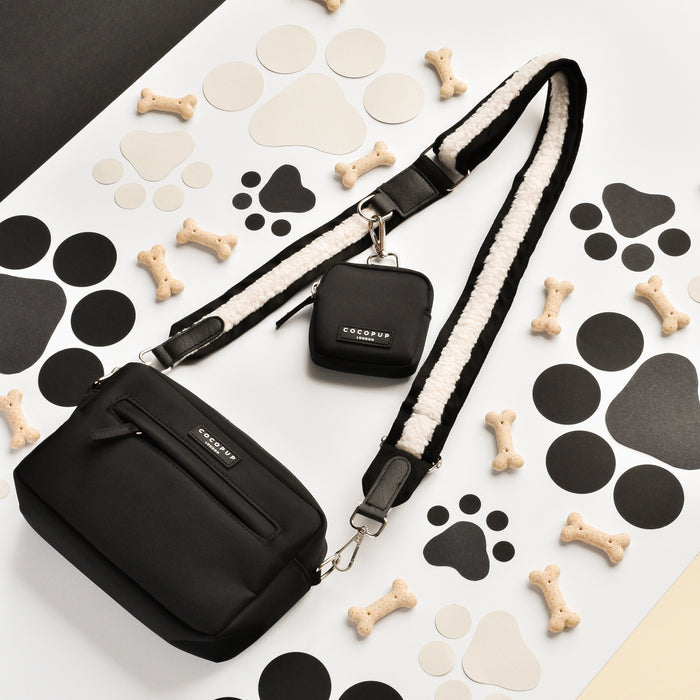 Black Cocopup London dog walking bag bundle with aviator-style details and treat pouch attachment.