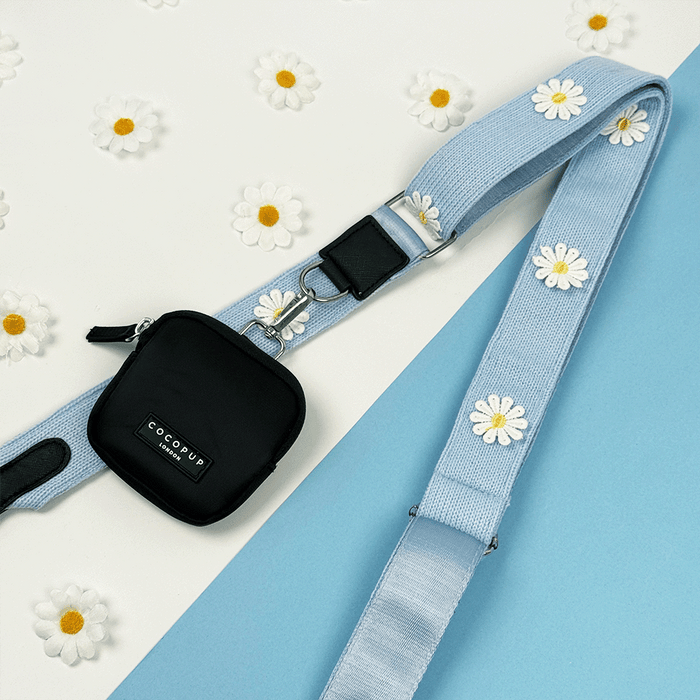 Blue Bag Strap with white flower decals.