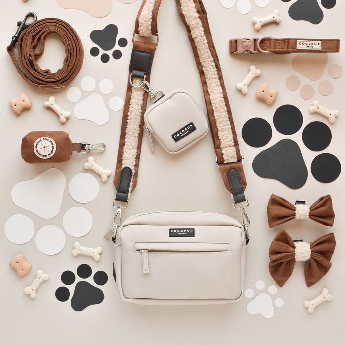 Brown Aviator dog walking bag bundle with matching strap, treat pouch, lead, collar, bow ties and poop bag dispenser.