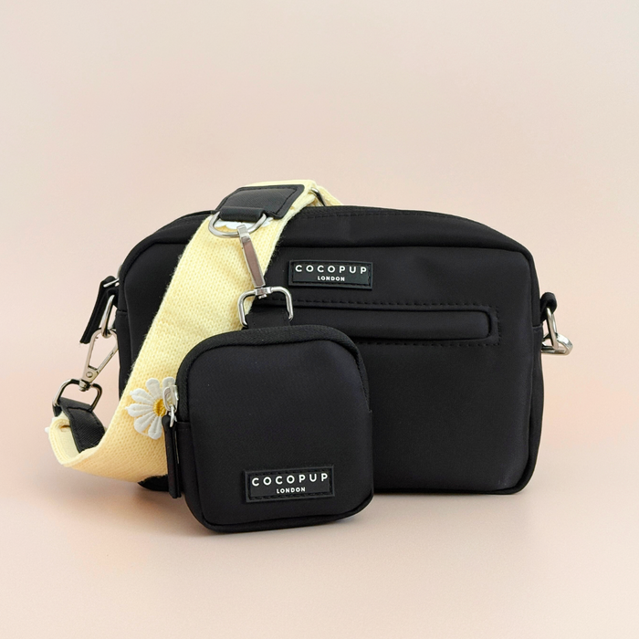 Buttercup yellow Cocopup London dog walking bag with matching strap and treat pouch on a neutral background.