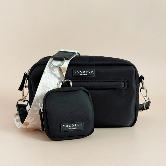 Cocopup London Dog Walking Bag Bundle in daisy chain pattern with matching treat pouch and dispenser on beige background.