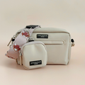 Small and medium Cocopup London Harold the Highland Cow bags with a pink strap featuring a bear face.