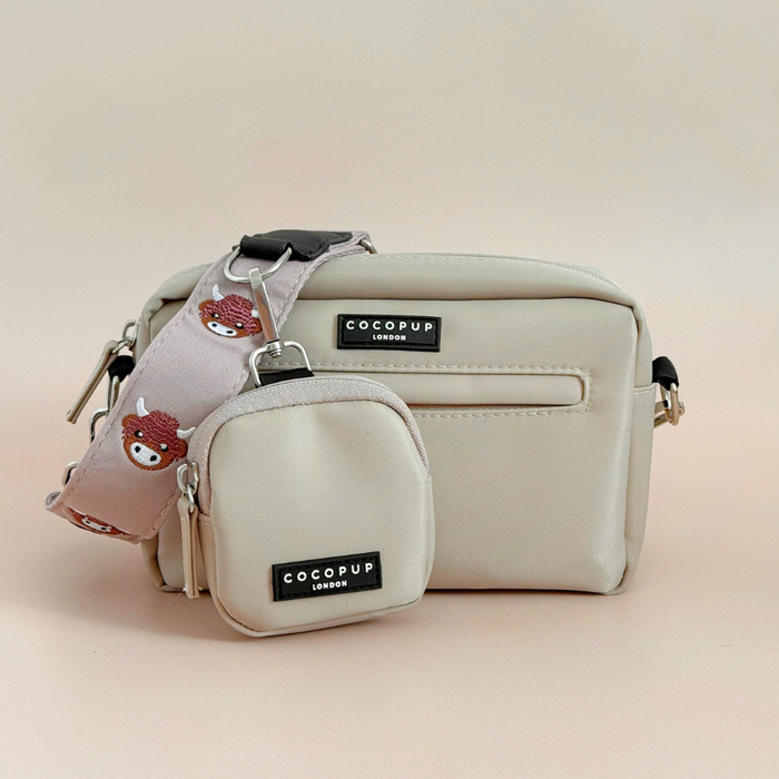 Small and medium Cocopup London Harold the Highland Cow bags with a pink strap featuring a bear face.