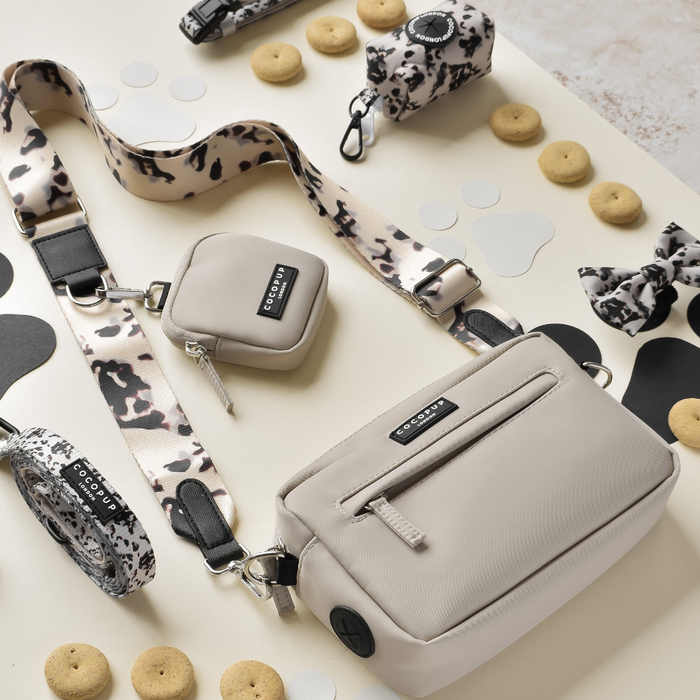 Tan leopard print dog walking set with leash, bag, treat pouch, and bow from Cocopup London.
