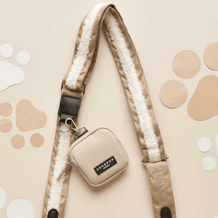 Cocopup London nude aviator dog walking bag set with matching treat pouch, both in a soft beige finish.