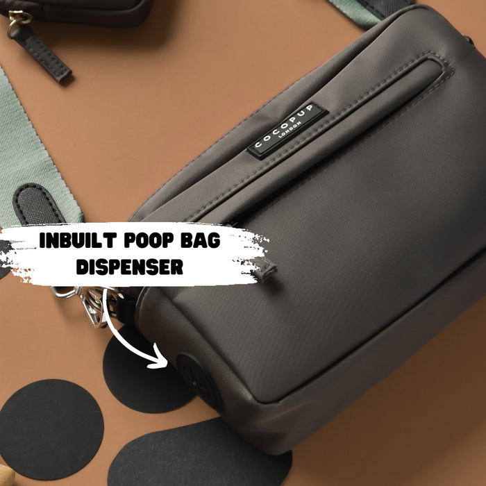Khaki Cocopup London dog walking bag with matching strap, visible label, and built-in poop bag dispenser.