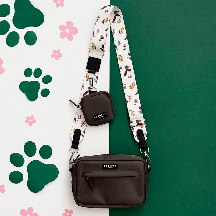 Cocopup London Mocha Bag in brown with a patterned strap, matching pouch, and built-in poop bag dispenser.