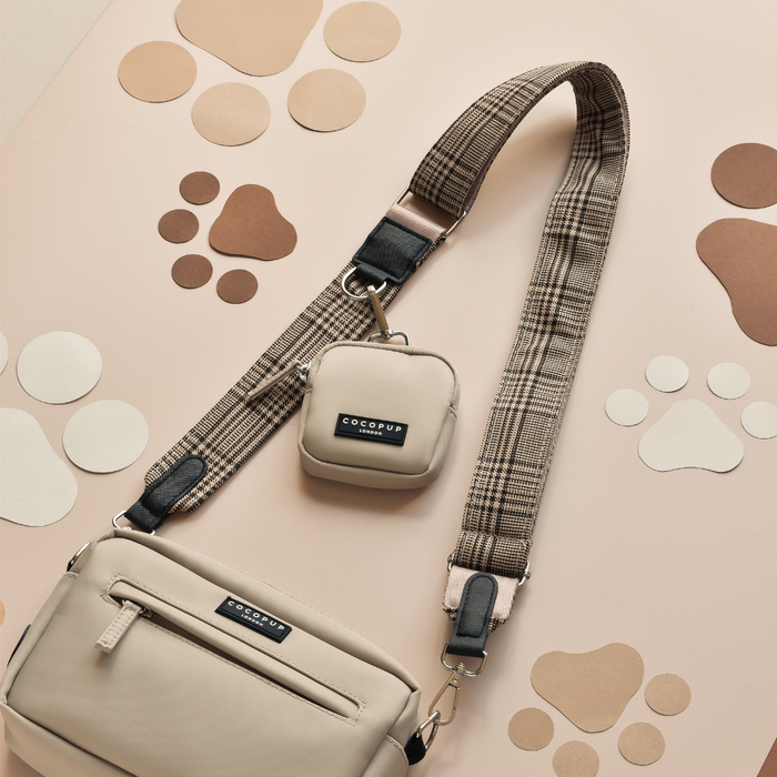 Cocopup London Dog Walking Bag Bundle in pup plaid pattern, displayed on a surface with paw prints and circles.