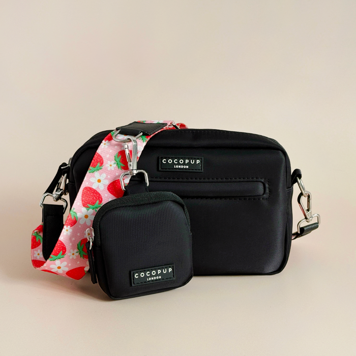 Two Cocopup London dog walking bags in Pupberry Fields design with colorful straps on a beige background.