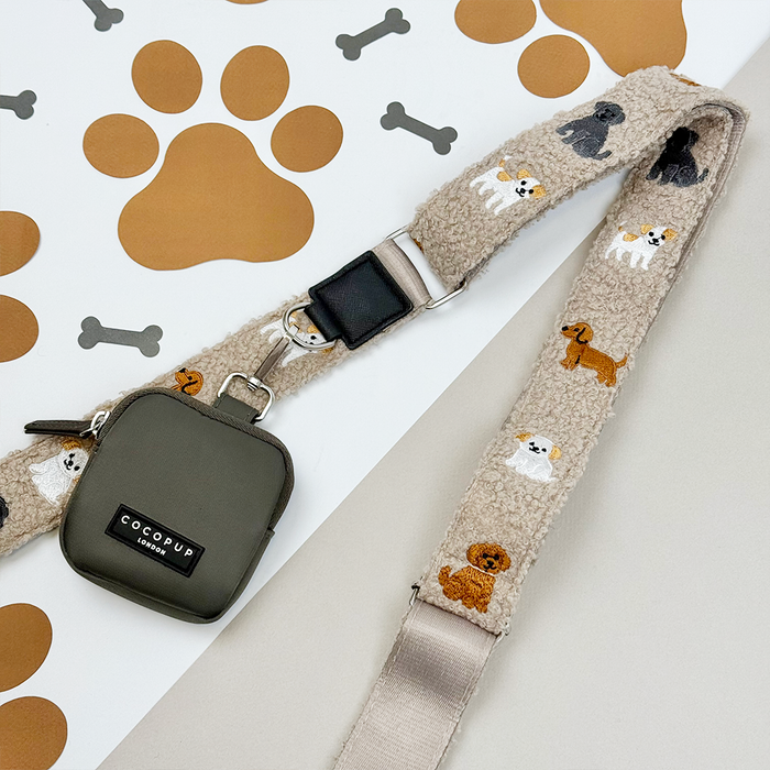 Mocha teddy-textured dog walking bag with beige leash featuring cartoon dogs and a green treat pouch.