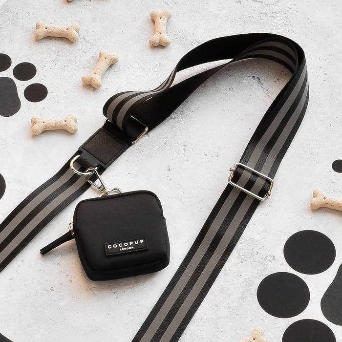 Reflective black Cocopup London dog walking bag bundle with treats and paw print stickers visible.