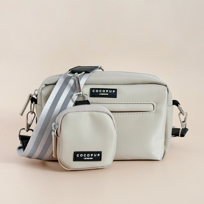 Reflective nude Cocopup London dog walking bag and matching treat pouch displayed on a light background.