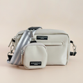 Reflective nude Cocopup London dog walking bag and matching treat pouch displayed on a light background.
