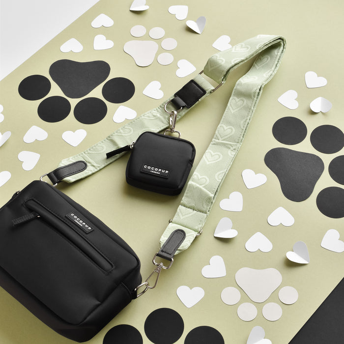 Cocopup London sage green heart dog walking bag with small treat pouch and light green adjustable strap.