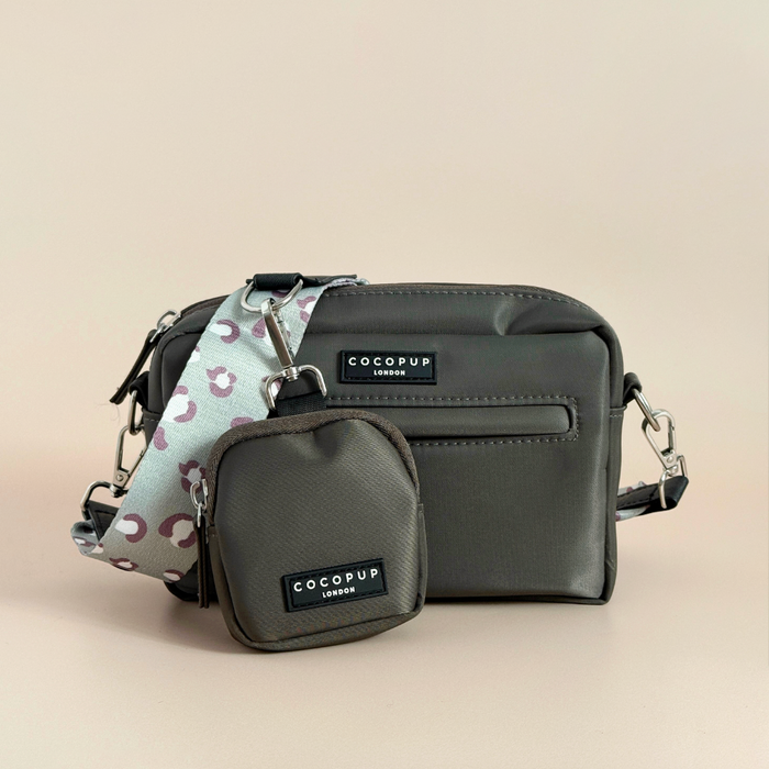 Sage green dog walking bag with leopard print, matching pouch, and strap, displayed on a neutral background.