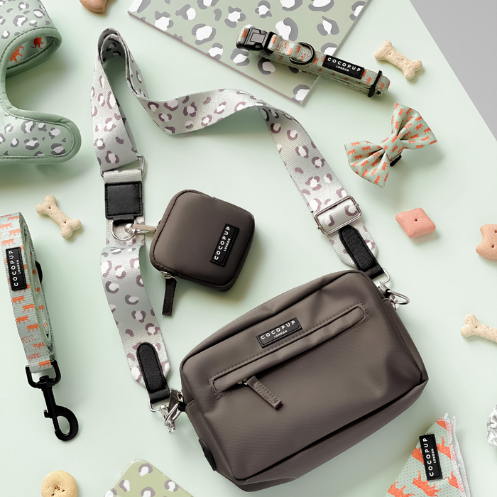 Sage green and leopard print dog walking bag set with matching leash, collar, harness, treat pouch, and poop bag holder.
