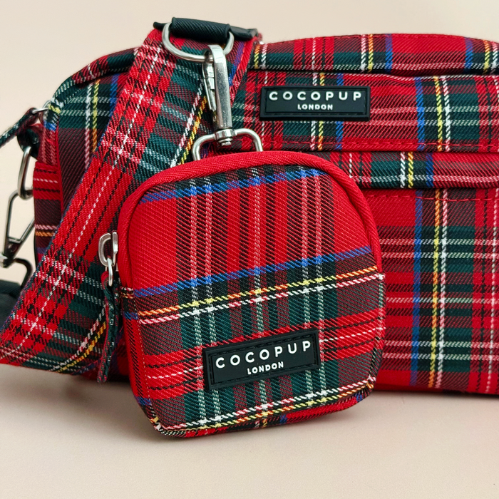 Two tartan Cocopup London dog walking bags, one large and one small, with black labels and silver hardware.