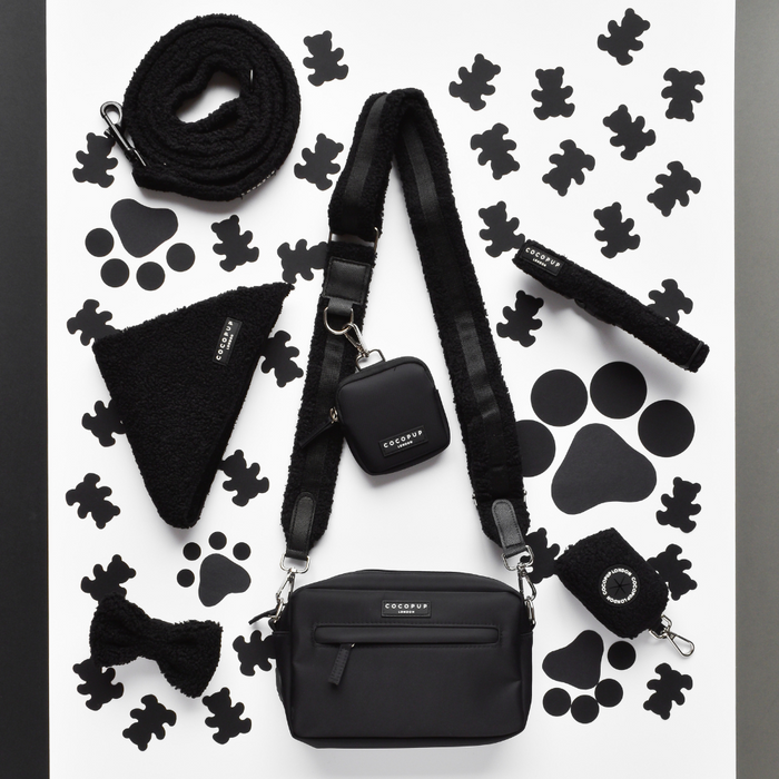 Cocopup London Teddy Baloo dog walking bag bundle with black accessories and white, dog-shaped patterned design.