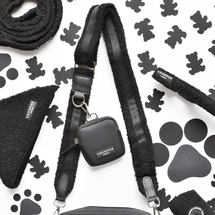 Cocopup London Teddy Baloo dog walking bag bundle with matching leash and treat pouch on a paw print background.