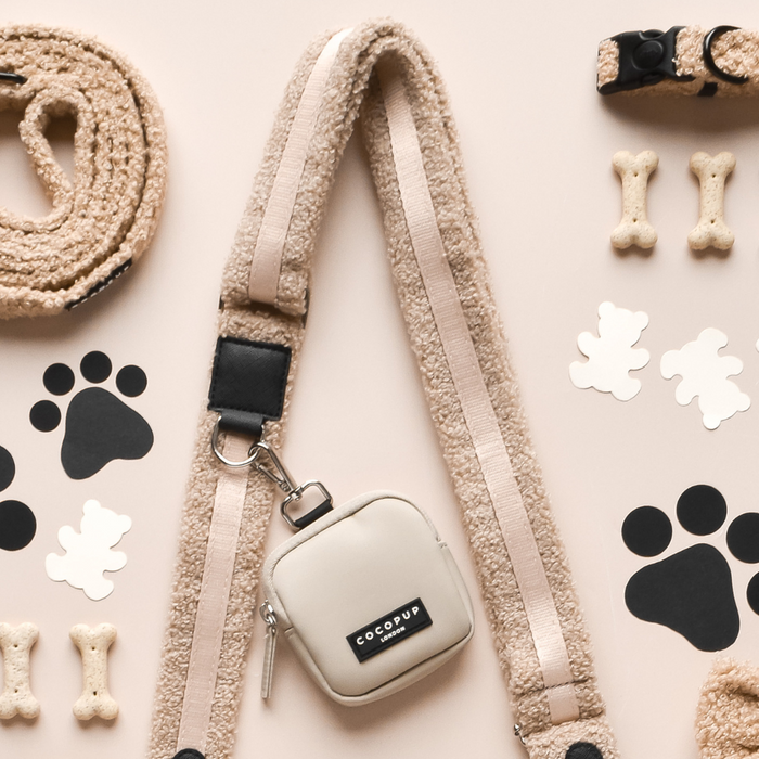 Teddy Rupert Cocopup London dog walking bag bundle with matching leash, pouch, treats, and accessories on a light surface.