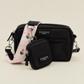 Black Cocopup Dog Walking Bag with Treat Pouch attached and pink bag strap with tulip embroidery design.
