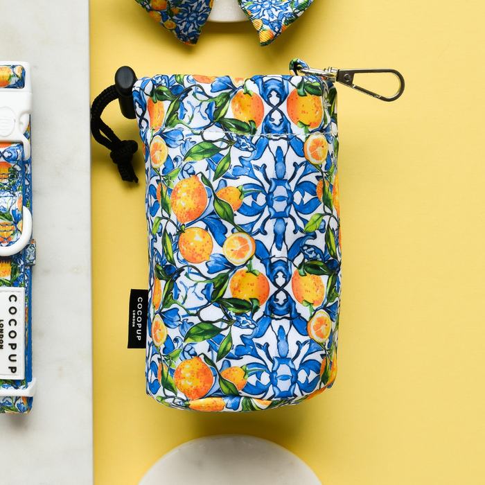 Yellow Cocopup London drawstring treat pouch with a vibrant lemon pattern and smooth, water-resistant finish.