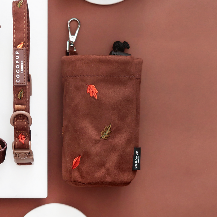 Cocopup London drawstring treat pouch with autumn leaf pattern in warm colors, compact and stylish fabric design.
