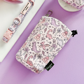 Lavender drawstring treat pouch with pink and purple dinosaur pattern, Cocopup London branding.