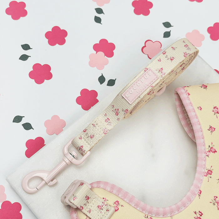 Floral Dog Lead with yellow background and pink flowers.