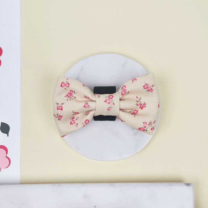 Floral Dog Bow Tie with yellow background and pink flowers.