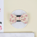 Floral Dog Bow Tie with yellow background and pink flowers.