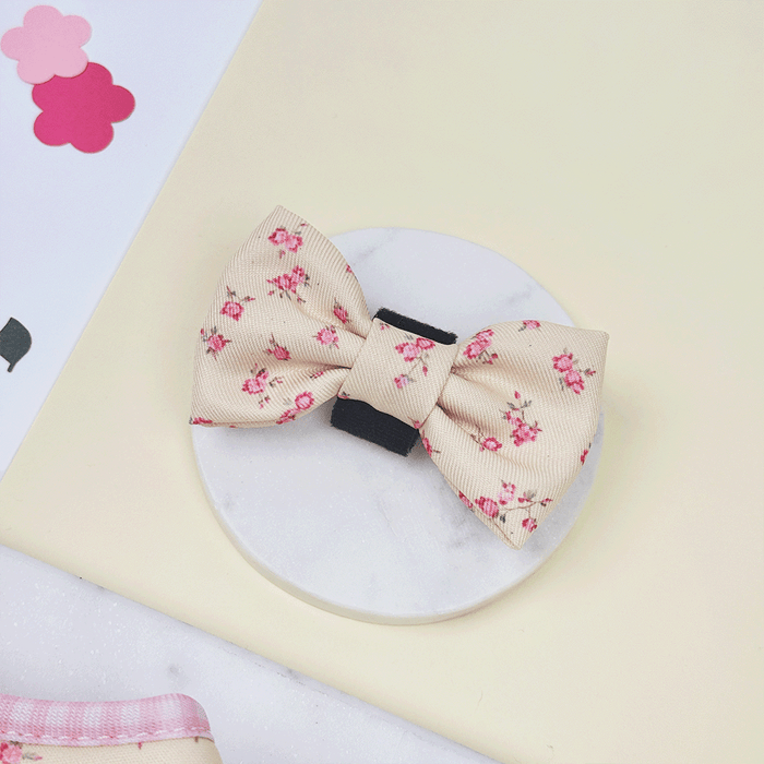 Floral Dog Bow Tie with yellow background and pink flowers.