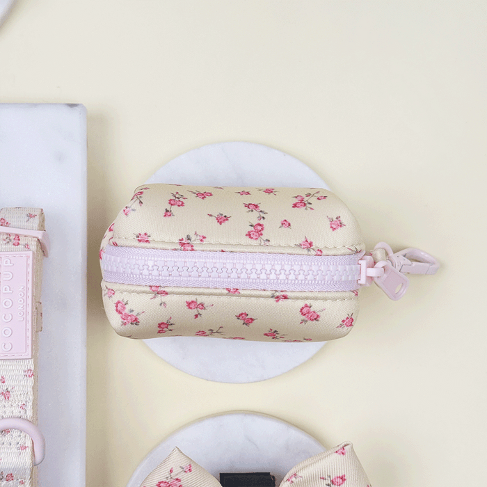 Floral Dog Poop Bag Holder with yellow background and pink flowers.