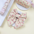 Floral Dog Sailor Bow Tie with yellow background and pink flowers.