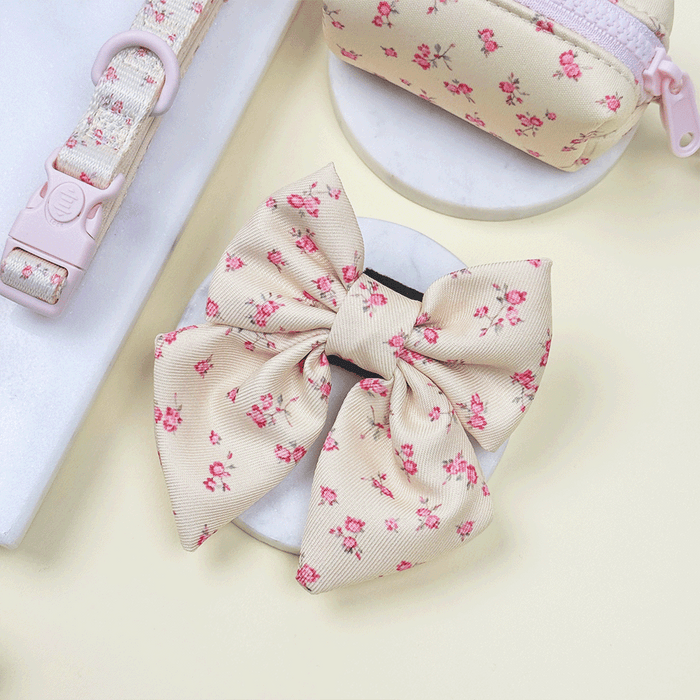 Floral Dog Sailor Bow Tie with yellow background and pink flowers.