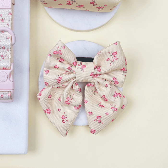 Floral Dog Sailor Bow Tie with yellow background and pink flowers.