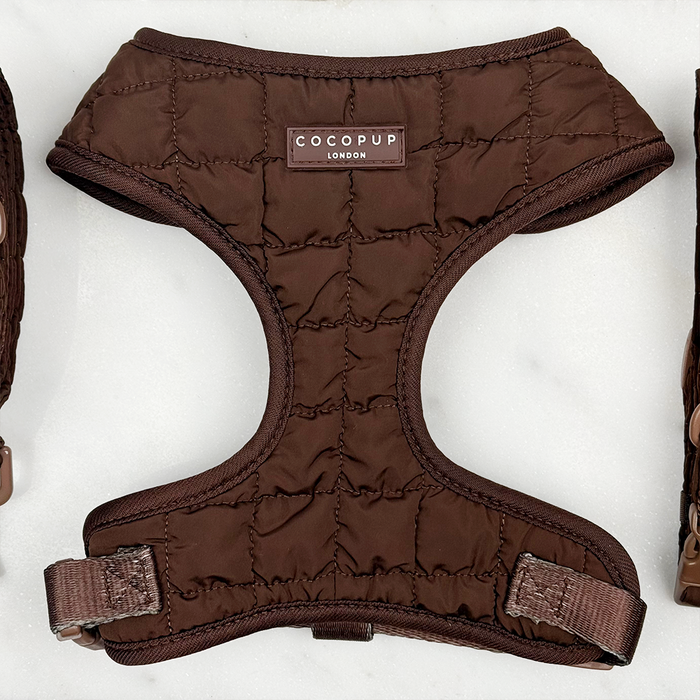 Brown quilted adjustable neck harness, lead, and collar set by Cocopup London laid flat on a light background.