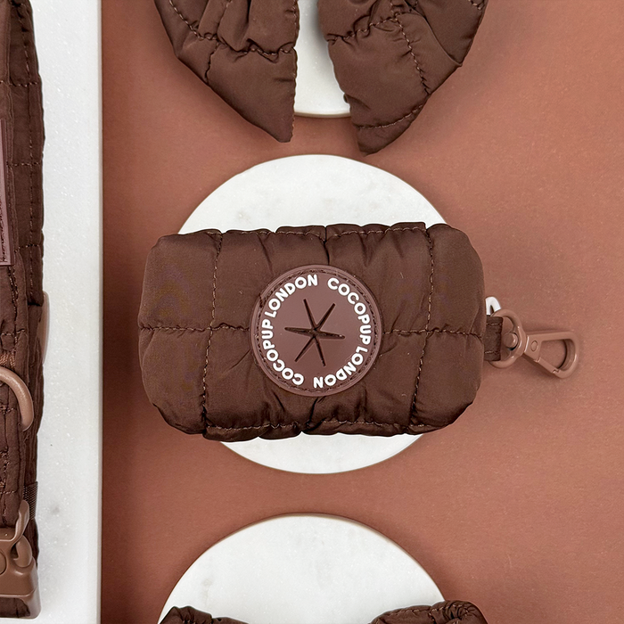 Brown quilted poop bag holder with gold zipper and clip, branded Cocopup London.