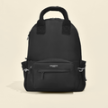 Black Cocopup London rucksack with front and side pockets, fabric handle, shown against a plain light background.