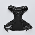 NAKD Liquorice Explore Harness by Cocopup London, black adjustable harness with metal ring on a light background.