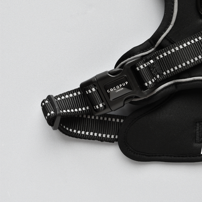 NAKD Liquorice Explore Harness by Cocopup London with reflective black straps and sturdy buckle, close-up view.