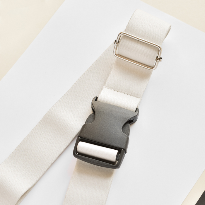 Oyster white Cocopup London bum bag strap with black buckle and silver slider.