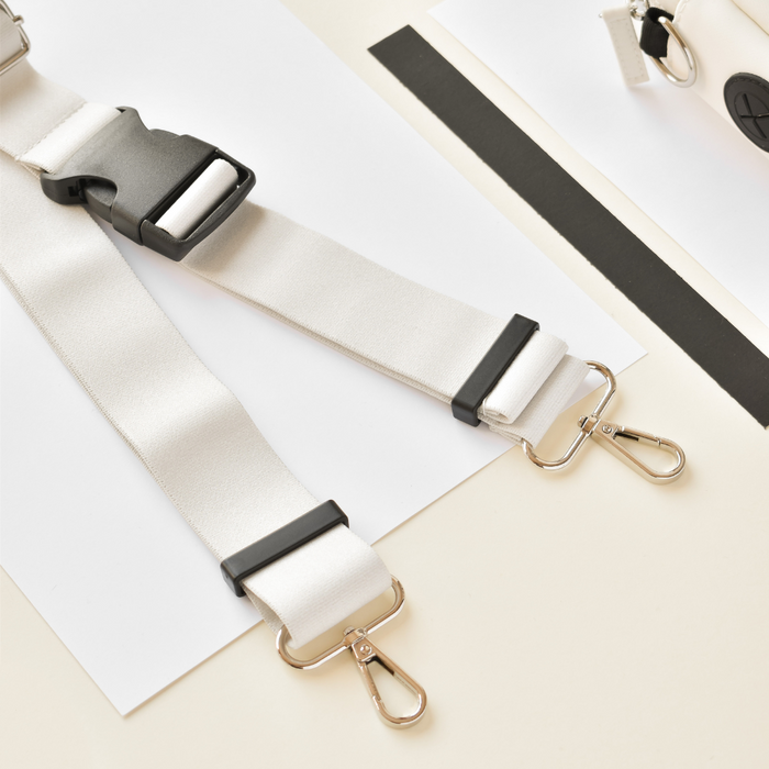 Two Oyster White Cocopup London bum bag straps with metal hooks.