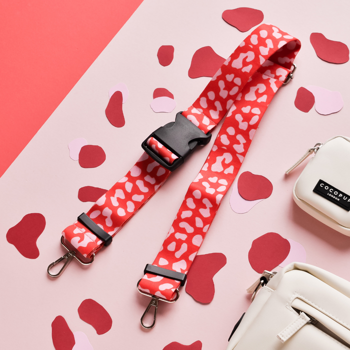 Cocopup London bum bag strap in red and pink leopard print with silver metal clasps.