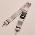 Mocha Cocopup London bum bag with beige strap, black buckle, and silver clasps shown laid flat.