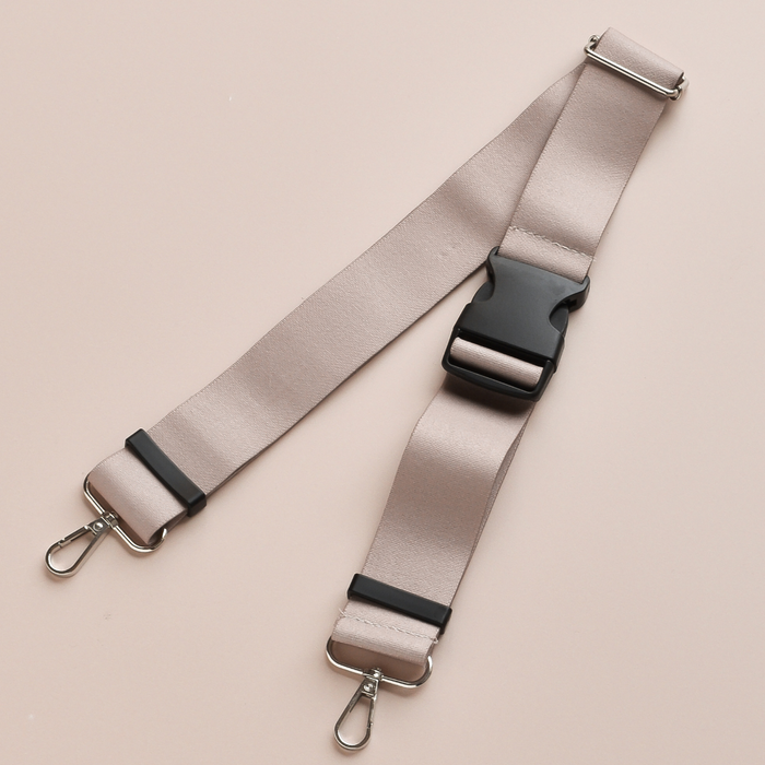 Mocha Cocopup London bum bag with beige strap, black buckle, and silver clasps shown laid flat.