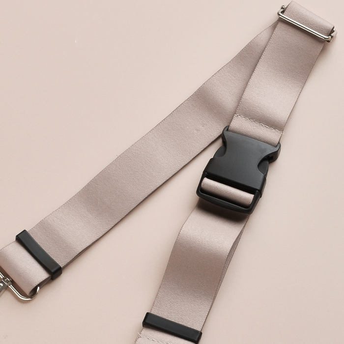 Plain nude Cocopup London bum bag strap with black buckle and metal clip.